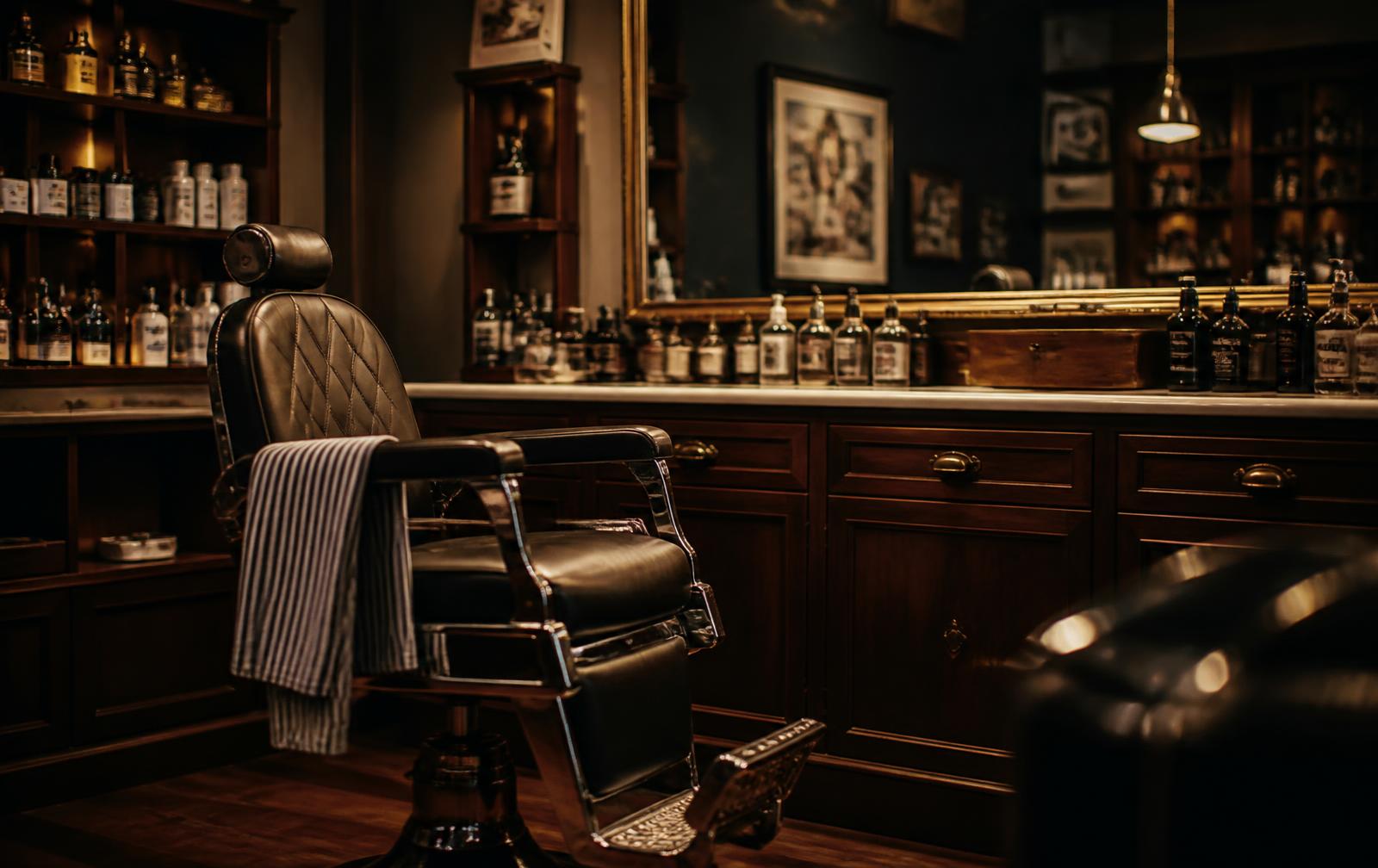 Warmly lit barber station with grooming products at Saner Styles in Columbus, Indiana